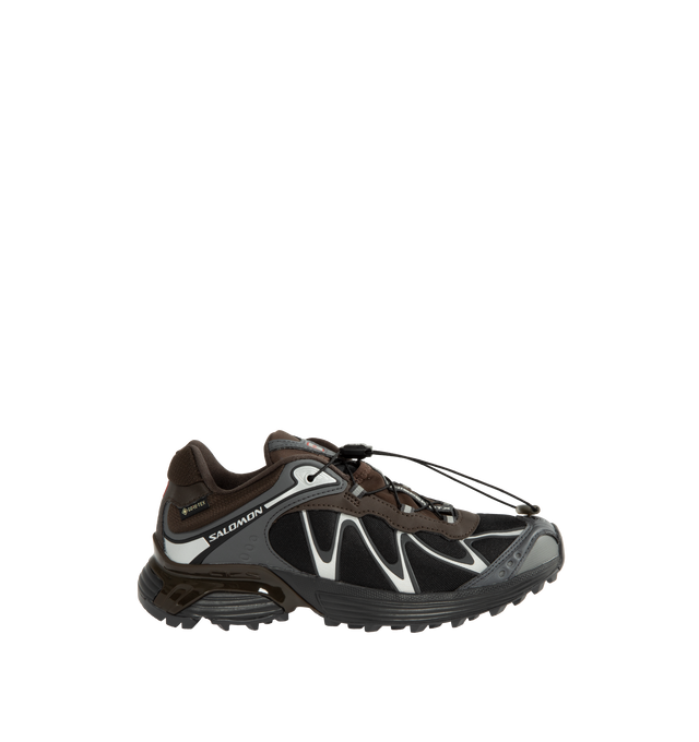 Image 1 of 5 - BROWN - Salomon Unisex XT-Whisper GORE-TEX Sneakers reimagine a trail-inspired icon with a modern performance-driven design. Crafted with a waterproof and breathable GORE-TEX membrane, this versatile style is engineered for all-weather wear while maintaining lightweight comfort and protection.Main Material: Synthetic and Textile Upper. Membrane: GORE-TEX Waterproof Protection. Closure: Quicklace System. Outsole: Contagrip Rubber.*Unisex style in men's sizing.