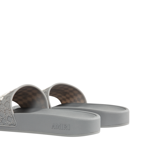 Image 3 of 4 - GREY - AMIRI MA Quad Pool Slides featuring rubber pool slides, logo pattern embossed throughout, open toe, logo embossed at vamp and outer side, molded rubber footbed and treaded rubber sole. Rubber.