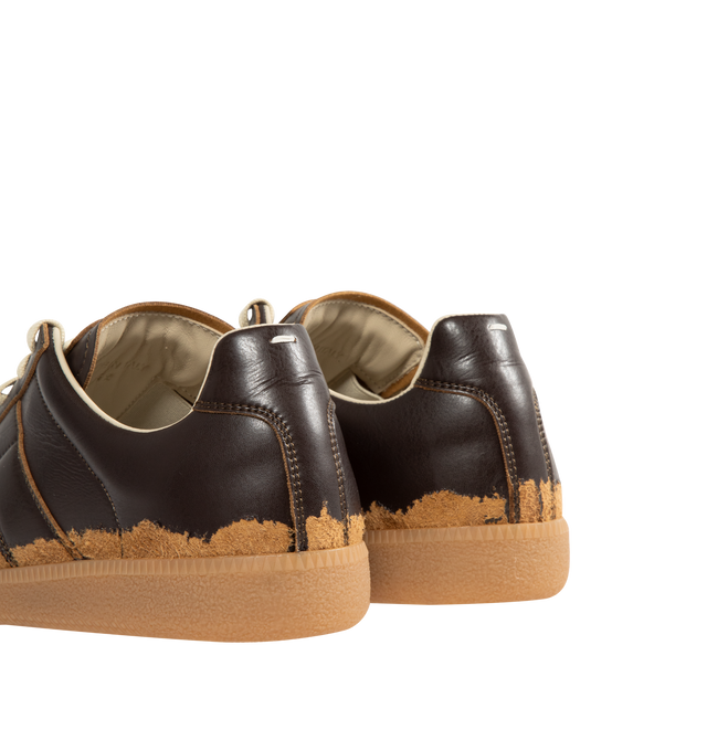 Image 3 of 5 - BROWN - MAISON MARGIELA Replica Sneakers featuring low-top sneakers with distressed contrast overlays, numeric signature tongue, rubber sole with a classic gum finish and white stitching at the back. Upper: 54% Polyamide-Nylon, 46% Polyurethane. Lining: 100% Cotton. Inside: 100% Calf Leather. Made in Italy.