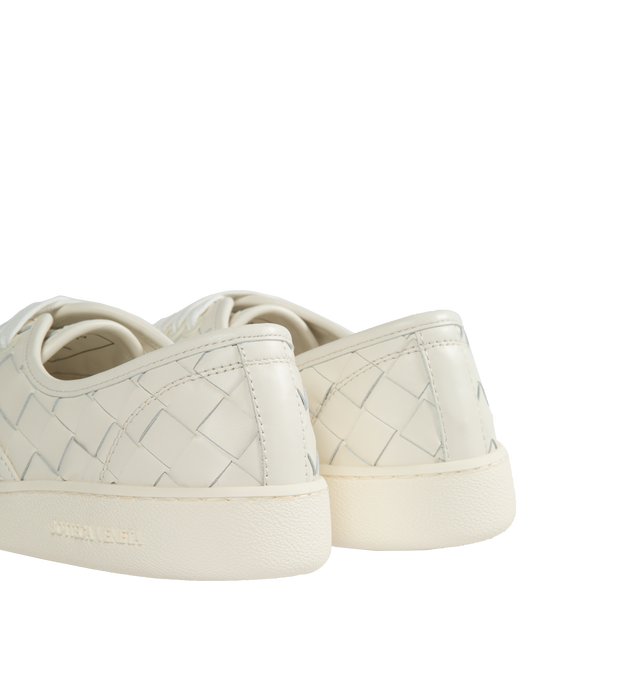 Image 3 of 5 - WHITE - BOTTEGA VENETA Sawyer Sneakers featuring lace-up closure, logo flag at side, buffed calfskin and suede lining, logo embossed at textured rubber midsole and treaded rubber sole. Upper: calfskin. Sole: rubber. Made in Italy. 