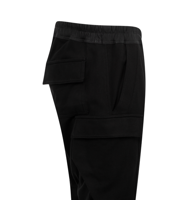 Image 3 of 3 - BLACK - RICK OWENS Men's Mastodon Megacargo Tapered Cotton-Jersey Drawstring Trousers in a comfortable heavyweight cotton-jersey. Pull-on style featuring signature elongated drawstrings, cargo pockets on each leg, ribbed trim at ankles. 100% cotton.