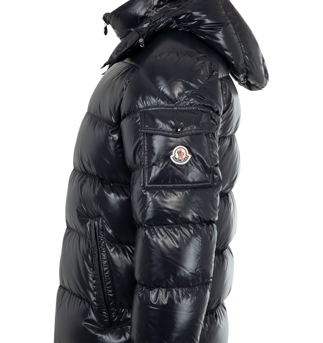 Image 4 of 4 - NAVY - MONCLER Maya Jacket featuring nylon laqu lining, down-filled with boudin quilting, detachable hood with snap buttons, adjustable with drawstring fastening, two-way zipper closure, zipped pockets, adjustable, elasticized cuffs with snap buttons, hem with drawstring fastening, flap patch pocket on sleeve and felt Moncler logo on sleeve. 100% polyamide/nylon. Padding: 90% down, 10% feather.