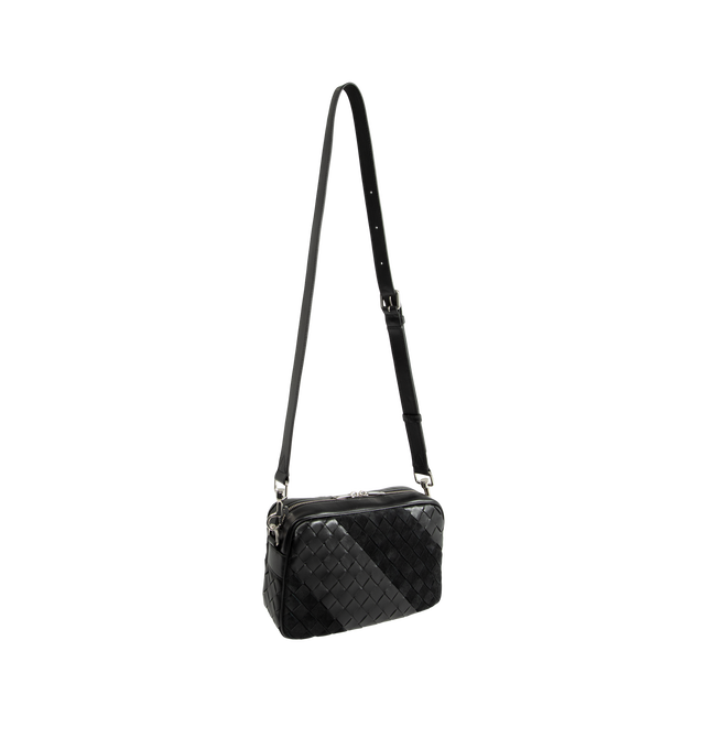 Image 2 of 3 - BLACK - Bottega Veneta Small Intrecciato Crossbody Bag is crafted from Intrecciato leather and suede and features a contrasting striped pattern, a detachable shoulder strap, a metal D-ring, and a zip-top closure. Designed with a canvas-lined interior and a flat pocket for organization, this compact style offers everyday versatility in a signature woven construction. Main Material: Intrecciato Leather and Suede. Lining: Canvas. Hardware: Silver Finish. Dimensions: 24.5 x 15 x 6 cm / 9.6 x 5.9