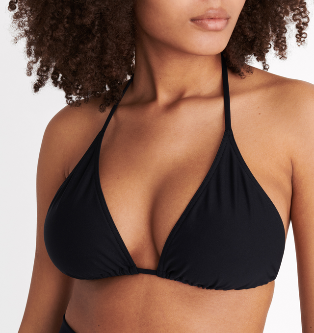 Image 7 of 8 - BLACK - ERES Energy Small Triangle Bikini Top featuring small triangle bikini top, multi-position and adjustable and sliding spaghetti straps (halter tie straight or crossed in the front) with branded tips. 84% Polyamid, 16% Spandex. Made in Morocco.  