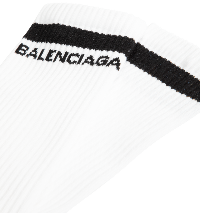 Image 2 of 2 - WHITE - Balenciaga Mens Logo Socks are crafted from a breathable cotton blend. Feature a high-length silhouette, ribbed cuffs, and jacquard logo detailing at the ankle. Main Material: 75% Cotton, 23% Polyamide, 2% Elastane. Made in Portugal.