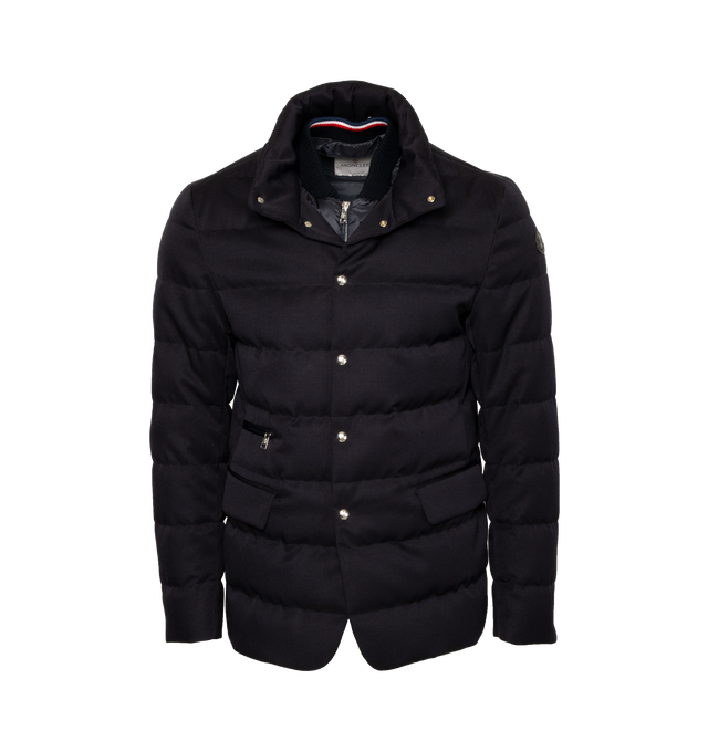 Image 1 of 5 - NAVY - MONCLER Bess Short Down Jacket featuring nylon lger lining, down-filled, pull-out, adjustable rainwear hood with elastic drawstring fastening and snap buttons, contrasting-colored interior piping, ribbed knit collar, inner front bottom with tricolored detailing, zipper and snap button closure, zipped external and internal pockets and leather logo. 100% virgin wool. Lining: 100% polyamide/nylon. Padding: 90% down, 10% feather. 