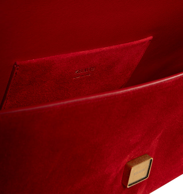 Image 3 of 3 - RED - Khaite Audrey flap-front clutch that combines refined lines with soft curves in velvety suede. Art Deco-inspired hardware at magnetic closure. Internal card pocket. Suede calfskin (100% calfskin). Made in Italy.