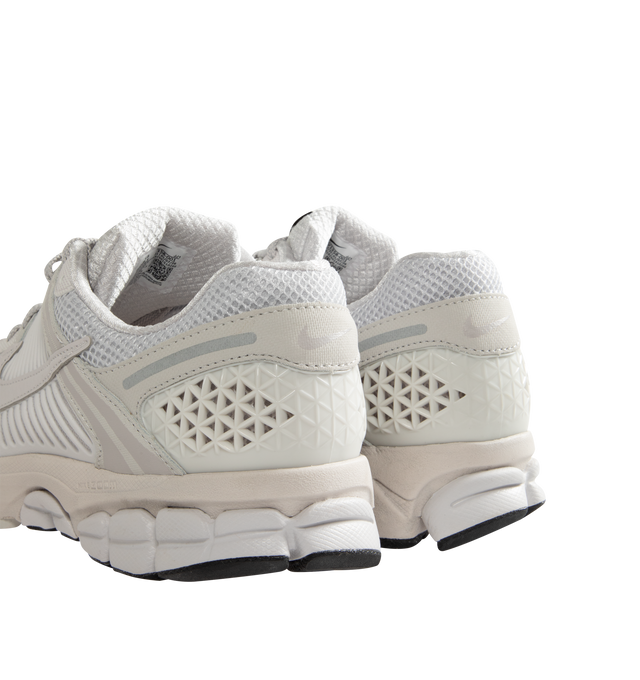 Image 3 of 5 - GREY - Nike Men's Zoom Vomero 5 SP Sneakers are a lace-up style with synthetic leather, mesh, rubber heel trim, and rubber outsole.