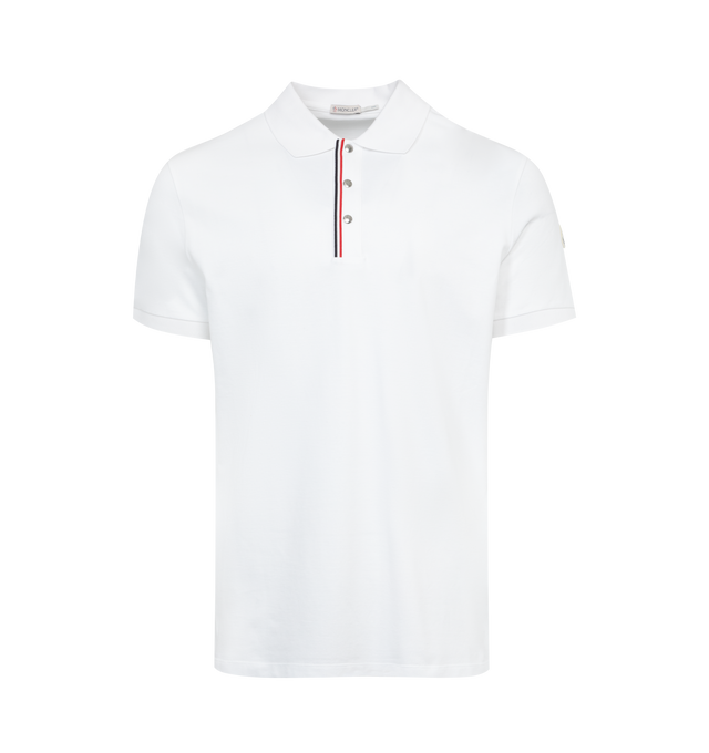 Image 1 of 2 - WHITE - MONCLER Polo Shirt featuring knit collar and cuffs, tricolor 3 button closure, polo collar and logo patch on sleeve. 100% cotton. 