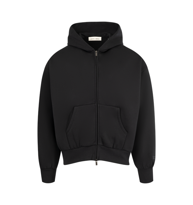 Image 1 of 2 - BLACK - FEAR OF GOD ESSENTIALS Classic Fleece Zip-Up Hoodie made from 380gsm core fleece featuring a classic fit with signature Fear of God relaxed proportions. A new beveled metallic "Essentials Fear of God" logo is branded across the back. Details include a double-layer hoodie, rib-knit cuffs, waist-hem, and a kangaroo pocket. A "Fear of God Essentials" rubberized label is stitched on the hood and sleeve. 80% cotton, 20% polyester fleece.