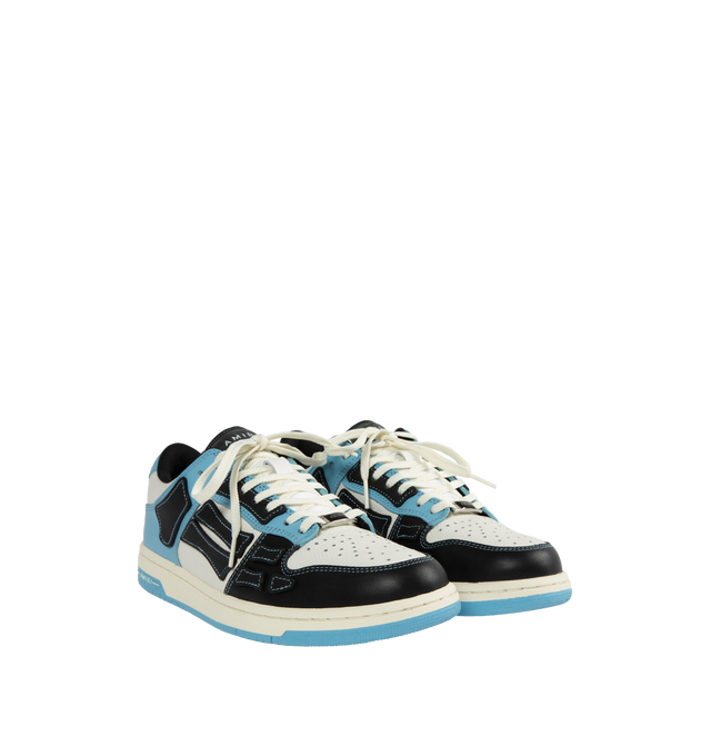 Image 2 of 5 - BLUE - AMIRI Skeltop Low featuring logo at the back, logo on the tongue, logo on the side and closed, round toe. Smooth and pebbled leather upper with rubber sole. 