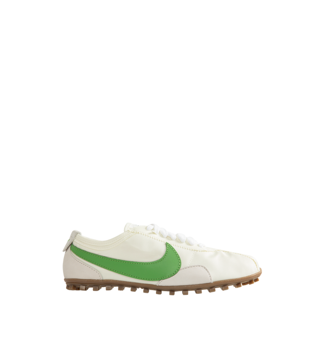 Image 1 of 5 - GREEN - Nike Men's Moon Shoe OG SP Sneakers feature a Sail, Light Bone, and Chlorophyll nylon upper with a leather Swoosh. Inspired by Nike's original 1970s running shoe, the streamlined silhouette is set on a rubber Waffle outsole for durable traction. Upper: Nylon and Leather. Sole: Rubber.