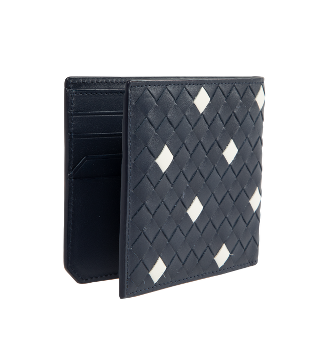 Image 2 of 3 - BLUE - BOTTEGA VENETA Intrecciato Piccolo Bi-Fold Wallet featuring calf leather wallet with polka dots, eight card slots, two note compartments and two additional pockets. The VN Preserve calf leather is realized through the BioBasedLeather process, which ensures a limited presence of petrol-based components and exclusive reliance on renewable energy sources. Calf leather. 3.7" x 4.3" x 0.4". Made in Italy.