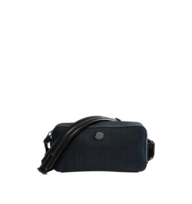 Image 1 of 3 - BLUE - Moncler Men's Carlo Denim Crossbody Bag is crafted from cotton-blend denim and features a spacious silhouette with an interior leather pocket for everyday organization. Designed with an adjustable shoulder strap, this designer crossbody bag is finished with leather trim, a micro-suede lining, an exterior snap-button pocket, an embossed logo base, and metal Moncler logo detailing. Exterior: 75% Cotton, 24% Polyester, 1% Elastane/Spandex. Lining: 100% Polyamide/Nylon. Leather Inserts: Co