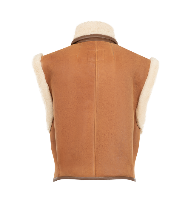 Image 2 of 3 - BROWN - Isabel Marant Womens Shearling Vest is crafted from genuine lamb fur and lamb leather. Features a stand collar, asymmetric button-front closure, sleeveless silhouette, contrast leather trim, and a cropped fit. Main Material: 100% Lamb Fur & Lamb Leather. Made in Turkey.
