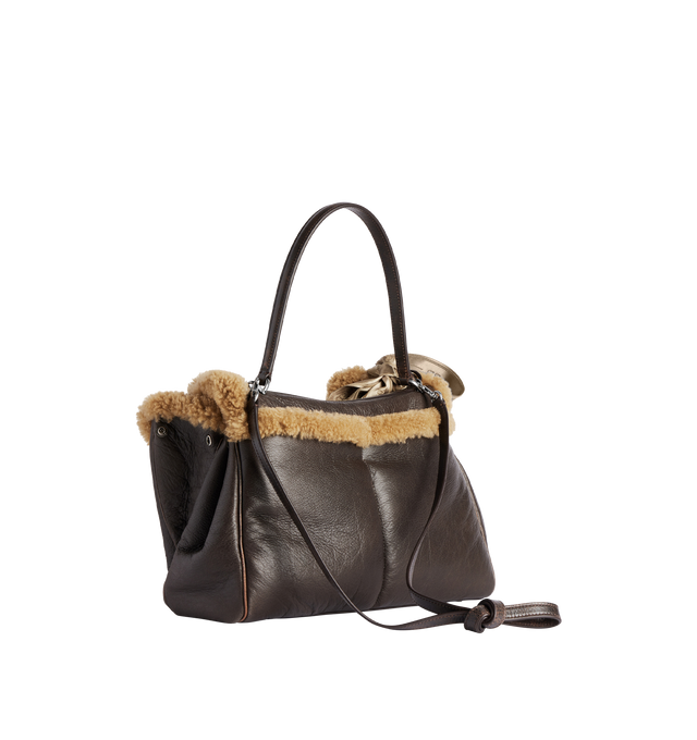 Image 2 of 4 - BROWN - BALENCIAGA Rodeo Handbag Medium in brown calfskin and beige shearling, aged-silver hardware featuring one handle, removable shoulder strap, removable cloche cls with two split rings, ribbon with Balenciaga logo on the front, turn lock closure, wide front pocket, 1 main compartment, 1 inner zipped pocket, 2 flat pockets at back, side snaps, 4 brass feet and Nappa lambskin lining. 13.8" x 9.6" x 4.3". Shearling, calfskin, polyester. Made in Italy.