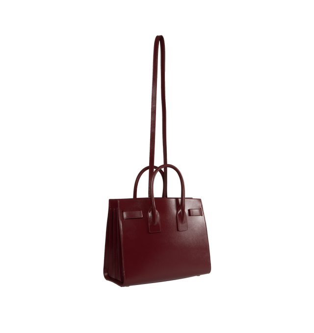 Image 2 of 3 - RED - SAINT LAURENT Sac De Jour Small YSL Bag has accordion sides, snap button , detachable padlock, bronze-tone hardware, and interior zipper pocket. 100% leather. Made in Italy.  