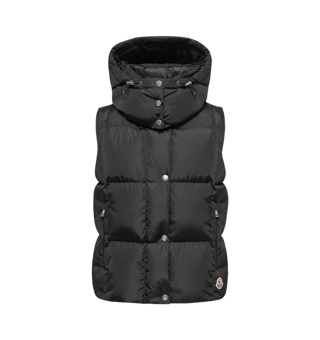 Image 1 of 1 - BLACK - Moncler Women's Macareux Down Vest is crafted from technical nylon with a subtle sheen and water-repellent finish, combining a minimalist aesthetic with lightweight warmth. Designed to layer over knitwear or beneath outerwear, this down-filled vest features a detachable and adjustable hood, a front zip closure with snap-button placket, zipped pockets, and a signature logo patch. Main Material: 100% Polyamide/Nylon. Lining: 100% Polyamide/Nylon. Padding: 90% Down, 10% Feather. Hood: De