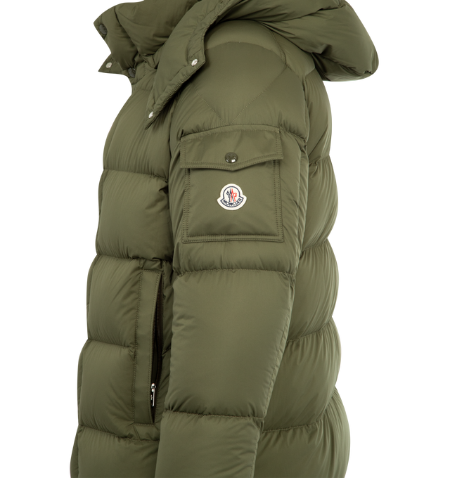 Image 5 of 5 - GREEN - MONCLER Vezere Short Down Jacket featuring recycled longue saison, nylon lger brillant lining, down-filled, detachable and adjustable hood, zipper and snap button closure, zipped pockets, patch pocket on the sleeve, adjustable cuffs and hem with drawstring fastening. 100% polyamide/nylon. Padding: 90% down, 10% feather.