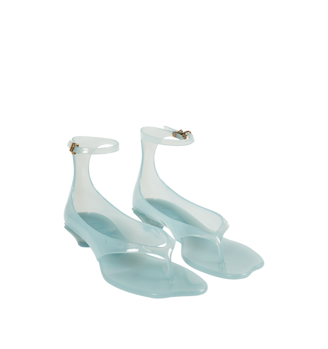 Image 2 of 4 - BLUE - CHLOE Jelly Sandal featuring transparent TPU, thong front with a distinctive wavy sole, shell-shaped heel, adjustable, buckled ankle strap and an oversized tonal Chlo logo on the sole. Sandal heel height: 1". Upper: TPU. Heel: polycarbonate.