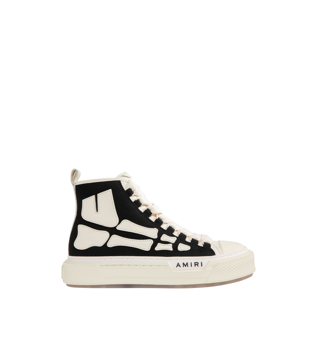 Image 1 of 5 - BLACK - AMIRI Skel Court Hi Sneakers featuring high-top cotton canvas and buffed leather sneakers, rubber cap toe, lace-up closure, logo embossed at tongue, pull-loop at heel collar, graphic appliqus at sides, logo embossed at outer midsole and treaded rubber sole. Upper: textile, leather. Sole: rubber.