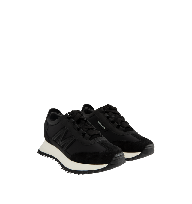 Image 2 of 5 - BLACK - Moncler Womens Pacey2 Sneakers feature a nylon, suede, and nubuck upper. Designed with a lace-up closure, mesh lining, padded construction, leather detailing, signature monogram accent, and TR outsole. Upper: Cow Leather and 100% Polyamide/Nylon; Lining: Cow Leather; Sole: 100% Elastodiene. Sole Height: 3.2 cm. Made in Vietnam.