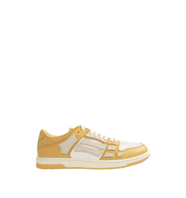 Image 1 of 5 - NEUTRAL - Amiri Men's Quad Skel Top Low Sneakers are a lace-up style with perforation details, signature graphics, leather appliques, and two-tone rubber soles. Leather uppers. Made in Vietnam.