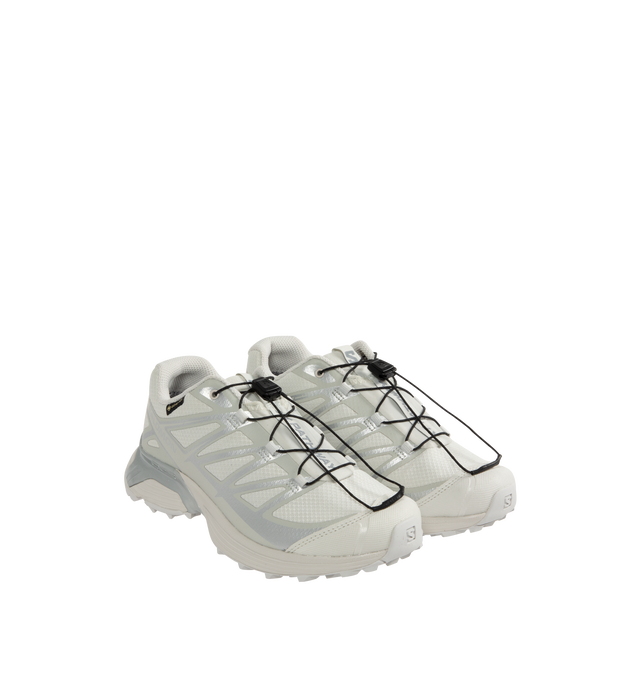 Image 2 of 5 - WHITE - Salomon XT-Pathway GTX Sneakers are a lace-up style with a quickLACE system, ACS stability, Mud Contagrip chevron rubber lug outsoles, anti-debris interior mesh, synthetic uppers, textile linings, lace pockets, protective toe caps, protective mudguards, OrthoLite die-cut sock liners, and GORE-TEX waterproofing. Unisex style in men's sizing.