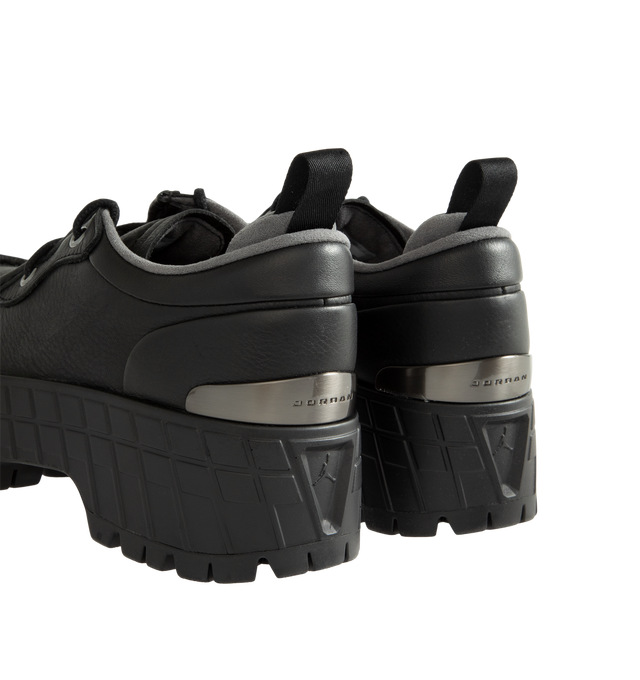 Image 3 of 5 - BLACK - Air Jordan 1 Brooklyn Low Women's Shoes combine smooth leather construction with a bold platform silhouette, featuring exaggerated outsole lugs and lightweight Nike Air cushioning for all-day comfort. Rooted in the heritage of the original AJ1, this elevated design is finished with Jumpman branding on the insole, blending iconic basketball DNA with a modern fashion-forward look. Main Material: Smooth Leather. Cushioning: Nike Air.