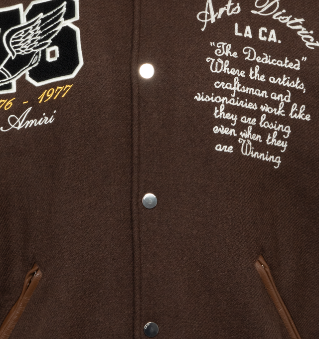 Image 3 of 4 - BROWN - AMIRI Oversized Eagle Varsity Jacket featuring front snap button closure, varsity inspired patches and side zipper pockets. 75% wool, 25% nylon. Lining: 100% viscose. Trim: 100% leather. Made in Italy. 