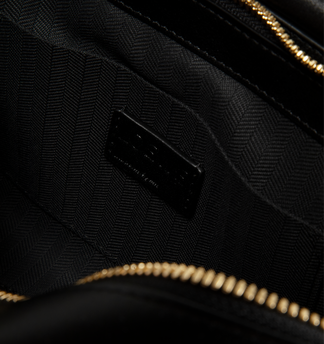 Image 3 of 3 - BLACK - Loewe Small Whisker Bag is crafted from black glazed calfskin and features a slouchy silhouette with a structured handle and oversized zip opening. Designed for shoulder, crossbody, or hand carry, it includes a detachable strap with rotating dog clips, articulated zipper pulls, foldable D-rings, an exterior flat pocket, and an interior flat pocket. Gold-tone hardware and embossed Loewe and Double L branding complete the design. Fits a large phone, small wallet, sunglasses, and keys. M
