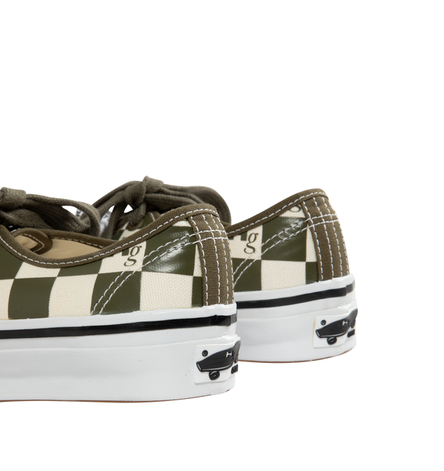 Image 3 of 5 - GREEN - VANS X HOMME GIRLS OTW Authentic 44 Sneaker featuring Heritage low-top shoe, Style 44, 8 oz canvas upper with 6 oz canvas bindings and heel strip, HommeGirls branded lace, with optional second lace, metal eyelets, higher sidewall with gloss finish, foxing tape, reinforced outsoles, Co-branded Foam ADC (All-Day Comfort) insole, signature waffle outsole pattern, all-over checkerboard pattern with Hg monograms and co-branded logo heel scab.
