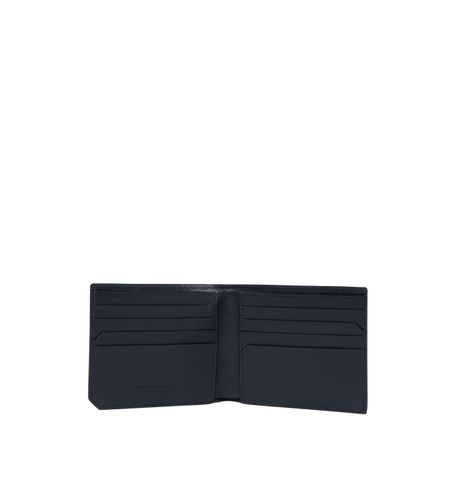 Image 3 of 3 - BLUE - BOTTEGA VENETA Intrecciato Piccolo Bi-Fold Wallet featuring calf leather wallet with polka dots, eight card slots, two note compartments and two additional pockets. The VN Preserve calf leather is realized through the BioBasedLeather process, which ensures a limited presence of petrol-based components and exclusive reliance on renewable energy sources. Calf leather. 3.7" x 4.3" x 0.4". Made in Italy.