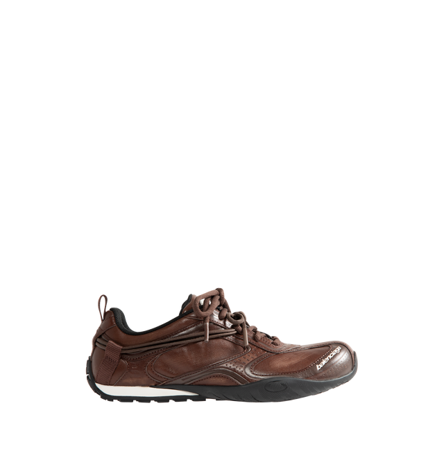 Image 1 of 5 - BROWN - Balenciaga Women's Radar Leather Sneakers are crafted from premium cowskin leather and feature a streamlined low-top silhouette with a distinctive worn-in finish, double lacing system, and debossed Balenciaga and 3B Sport logo detailing. Inspired by speed and technical performance, these designer sneakers are finished with a padded foam insole, durable rubber outsole with signature loop sports icon artwork, a back pull tab, and a sleek profile for elevated everyday wear. Upper: Cowski