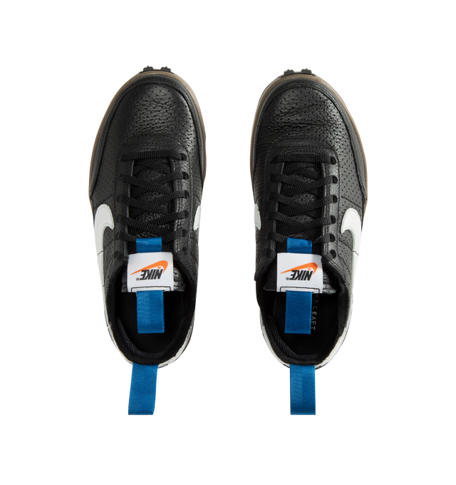 Image 5 of 5 - BLACK - Tom Sachs x Nike Unisex NikeCraft General Purpose Shoe "Demerits" is crafted from durable leather and features a low-profile silhouette inspired by everyday utility and wearability. Designed with blue nylon herringbone pull straps, a premium microfiber collar, and an embroidered "NIKE" logo in Tom Sachs' handwriting at the heel, this edition references the designer's "Demerits" concept. Main Material: Leather Upper. Collar: Premium Microfiber. Midsole: Gum Rubber with EVA Foam C