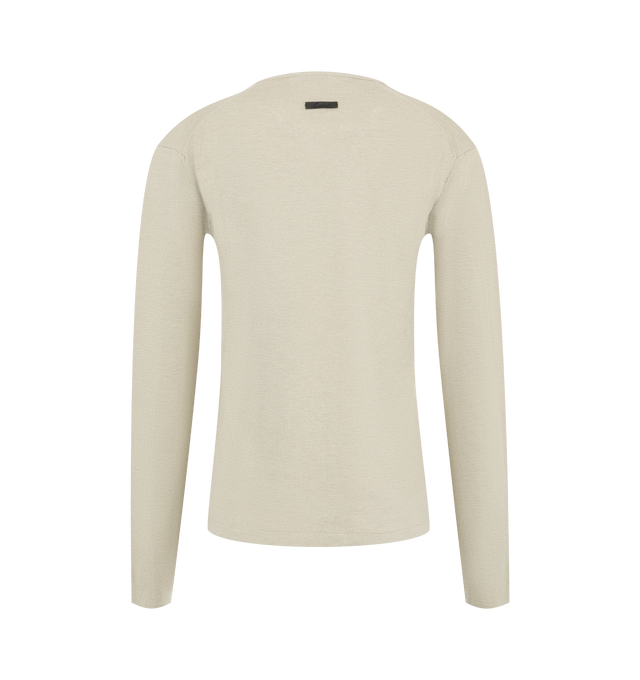 Image 2 of 2 - NEUTRAL - Fear of God Essentials Womens Slim Long Sleeve Top is crafted from a soft knit. Features a classic slim contoured fit, ribbed crew neckline, long sleeves, and an Essentials signature label at the back collar. Main Material: 88% Polyester, 12% Nylon.