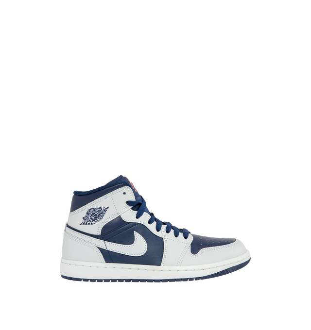 Image 1 of 5 - NAVY - JORDAN Air Jordan 1 Mid Sneaker featuring mid-top, leather, synthetic leather, textile upper, foam midsole, Nike Air cushioning and rubber outsole with pivot circle.