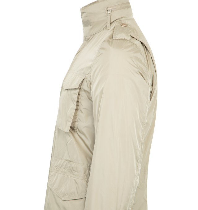 Image 4 of 4 - NEUTRAL - ASPESI Minifield Shell Jacket featuring front press-stud and zip fastening, epaulettes, long sleeves with touch-strap cuffs, two chest patch pockets, and two front flap pockets, internal drawstring fastening at waist and straight hem with an elasticated-drawstring. 100% polyamide.