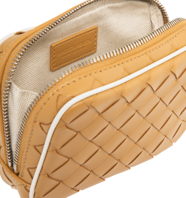Image 3 of 3 - NEUTRAL - Bottega Veneta Teen zipped pouch in Intrecciato calf leather with contrasted piping. Features interior leather tag with embossed logo, zipper closure, canvas lining, silver finish hardware. Measures 3.9" high x 5.7" wide X 1.2" deep. Made in Italy.