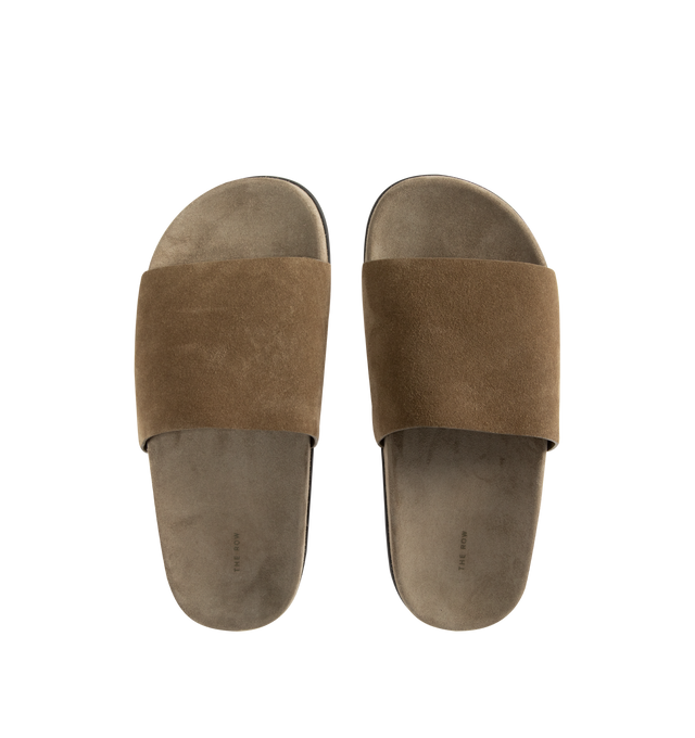 Image 4 of 4 - BROWN - THE ROW Hugh Slide featuring flat slip-on sandal in soft calfskin suede with contoured footbed and rubber sole. 100% calfskin leather. Synthetic sole. Made in Italy.