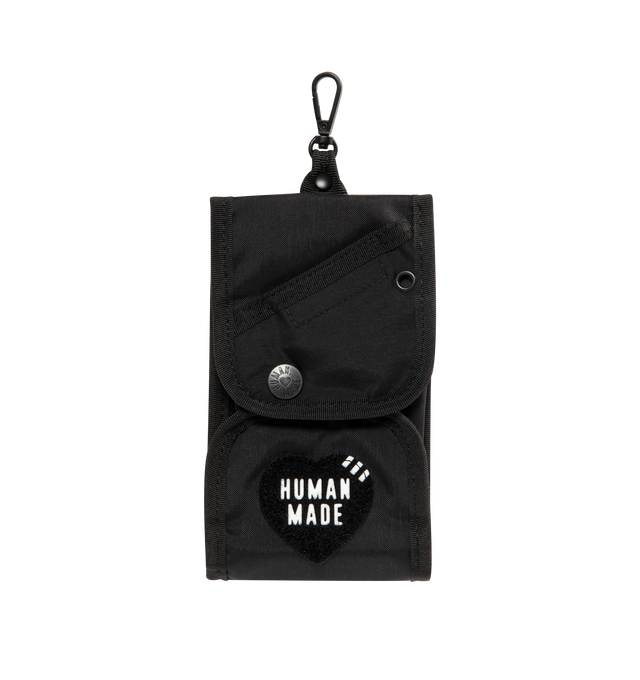 Image 1 of 4 - BLACK - HUMAN MADE Military Pouch featuring shoulder strap, lightweight and durable nylon Oxford fabric, heart-shaped magic tape, removing the tape reveals a text graphic, total of four pockets inside and out, brand logo appears on the shoulder strap and compact size for carrying a smartphone. 100% nylon.
