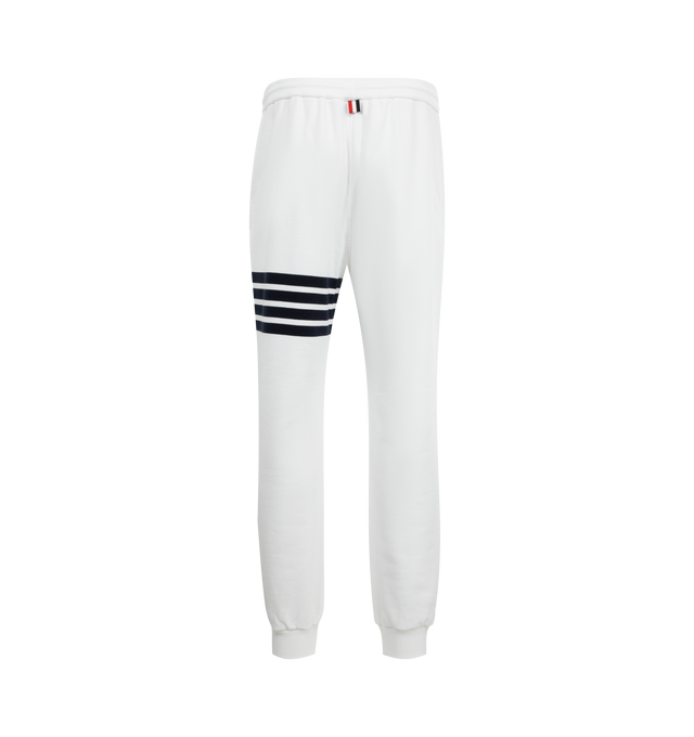 Image 2 of 3 - WHITE - THOM BROWNE Classic Loopback 4 Bar Sweatpants featuring iconic 4-bar detailing, pull-on, drawstring waistband with silver tone aglets, side slip pockets, name tag applique and signature striped grosgrain loop tab. 100% cotton. Made in Italy.