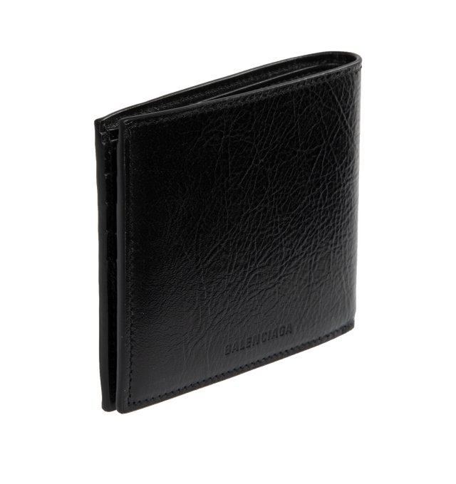 Image 2 of 3 - BLACK - BALENCIAGA Le Cagole Square Folded Wallet featuring Balenciaga logo embossed tone-on-tone at back, aged-silver hardware, front zipped pocket, 8 card slots, 2 bill pockets and 2 receipt compartments. L8.7 x H3.9 x W0.4 inch. 100% lambskin. Made in Italy. 