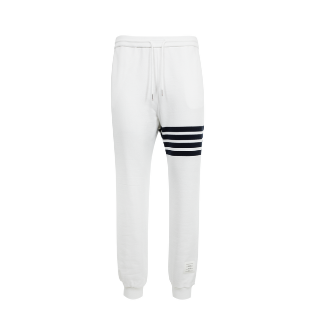 Image 1 of 3 - WHITE - THOM BROWNE Classic Loopback 4 Bar Sweatpants featuring iconic 4-bar detailing, pull-on, drawstring waistband with silver tone aglets, side slip pockets, name tag applique and signature striped grosgrain loop tab. 100% cotton. Made in Italy.