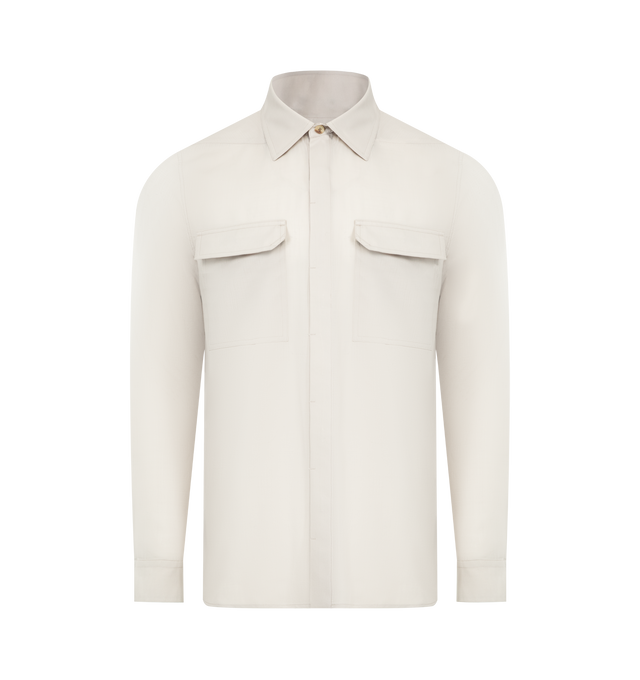 Image 1 of 2 - NEUTRAL - RICK OWENS Work Shirt featuring saddle shoulders with single-button barrel cuffs, concealed button closure, shirttail hem, spread collar and front flap pockets. 100% organic cotton. Made in Italy.