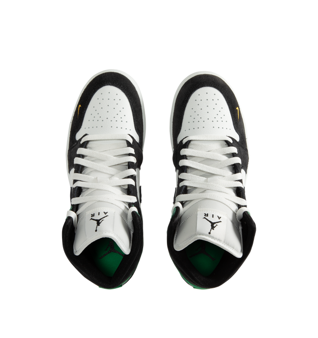 Image 5 of 5 - GREEN - Men's Air Jordan 1 Mid SE Sneakers feature a genuine leather upper with the iconic mid-top silhouette, signature Wings branding, and a stitched Swoosh for a timeless heritage look. These lifestyle sneakers combine encapsulated Air-Sole cushioning, a padded collar, and a durable rubber outsole for lightweight comfort, lasting support, and reliable traction. Main Material: Genuine Leather. Midsole: Encapsulated Air-Sole Unit. Sole: Rubber.