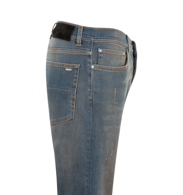 Image 3 of 3 - BLUE - Amiri Mens MX1 Jeans are crafted from Italian stretch denim. Features hand-distressed detailing, pleated flannel repair panels, classic five-pocket styling, and signature MX1 construction. Main Materials: 92% Cotton, 8% Elastane. Made in Romania.