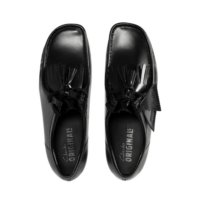 Image 4 of 4 - BLACK - CLARKS Wallabee Hi Shine Leather Shoe featuring dress leather uppers, lace tassels, three FOBS Clarks Originals, kiltie FOB and 200 years FOB, removable tonal kiltie, natural pebble crepe with a black sole spray, Clarks Originals heat embossed logo on sock, moccasin construction and hand stitched apron seam.