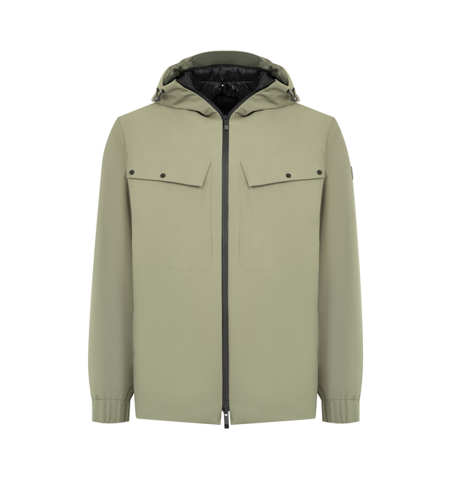 Image 1 of 3 - GREEN - MONCLER Escurays Hooded Short Down Jacket featuring 2L technical polyester, water-repellent main fabric, nylon lining, down-filled, adjustable hood, zipper closure, zipped pockets, adjustable hem and silicone logo patch. 100% polyester. Lining: 100% polyamide/nylon. Padding: 90% down, 10% feather. Made in Romania.