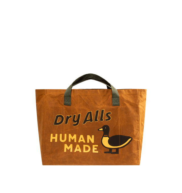 Image 1 of 3 - BROWN - HUMAN MADE Decoy Tote featuring vintage-inspired design, cotton canvas fabric, highly water-repellent with unique texture from paraffin treatment, contrasting handles, iconic camo and heart logo graphics on front and back, dye-print graphic, leather patching details and inner storage sections. 100% cotton.